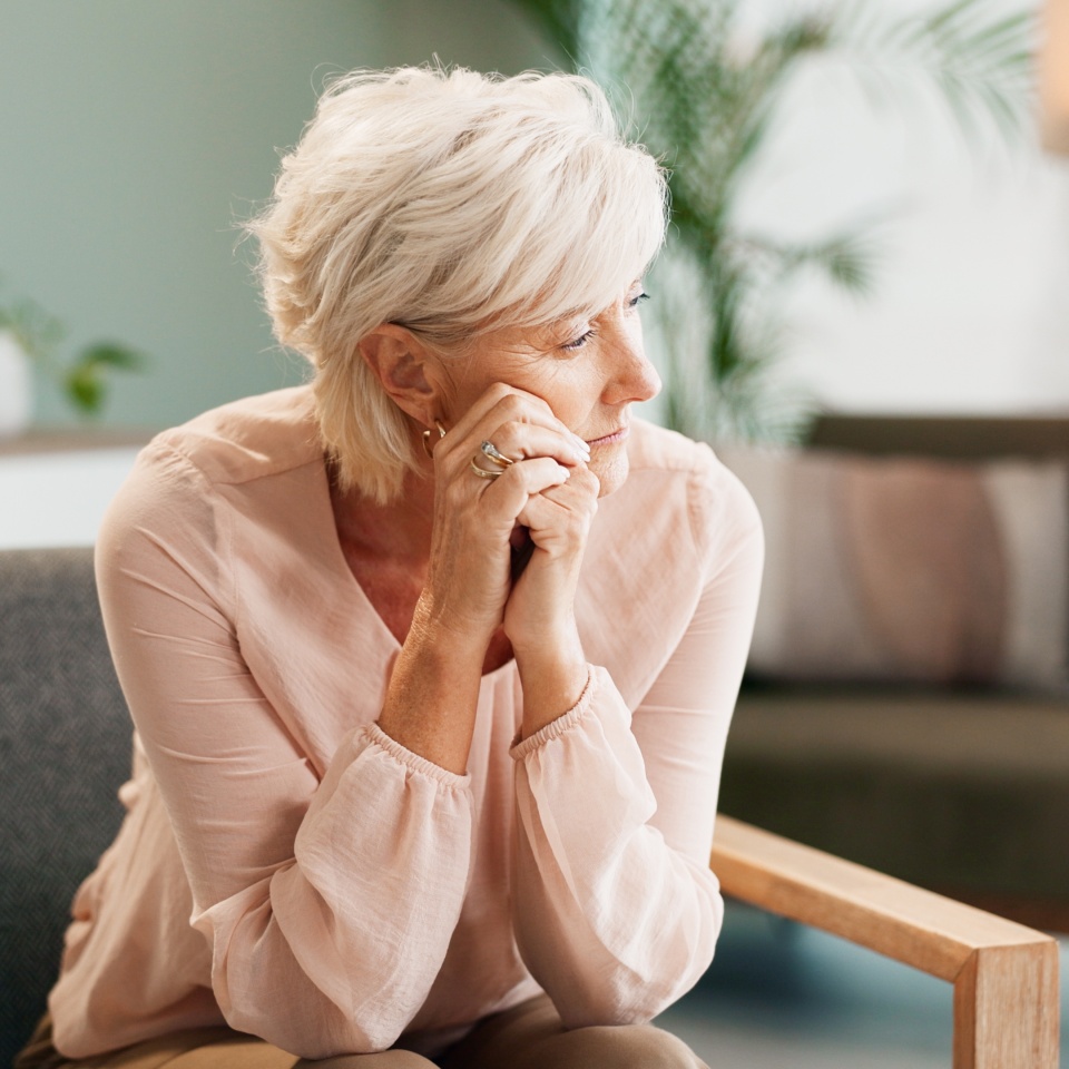 Depression, psychology or old woman thinking with psychologist in consultation office for mind, evaluation or assessment. Help, stress or sad client with therapist for counseling, help or ptsd trauma
