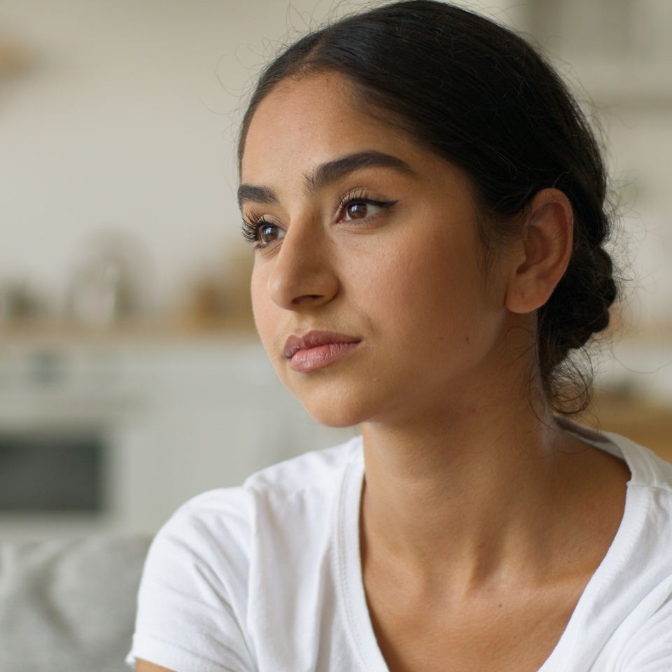 Portrait sad upset worried frustrated stress Muslim Islamic Indian woman Arabian girl female lady suffer migraine headache pain head at home loan mortgage bankruptcy problem health trouble anxiety
