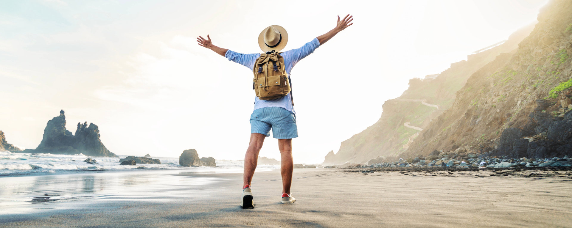 Person stands with arms outstretched 
